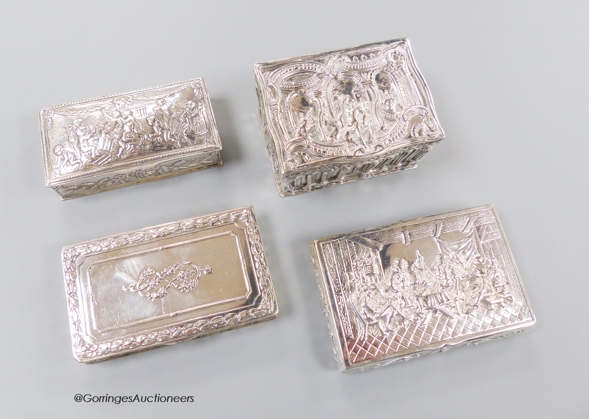 Three early 20th century German 800 standard white metal snuff boxes and one other continental white metal box, largest 86mm, 11.5 oz.